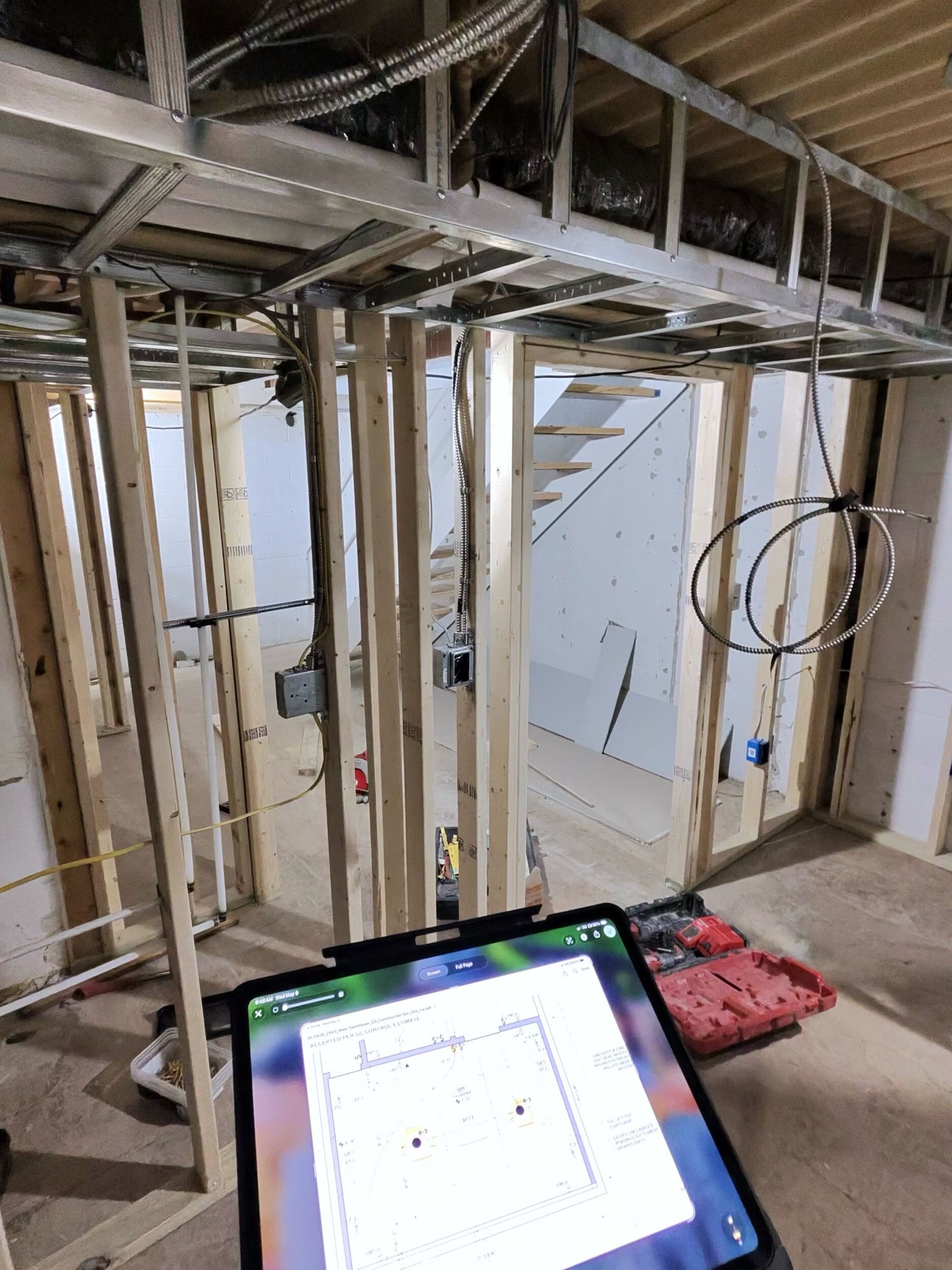 Framing, open stair, and lower-level service wall