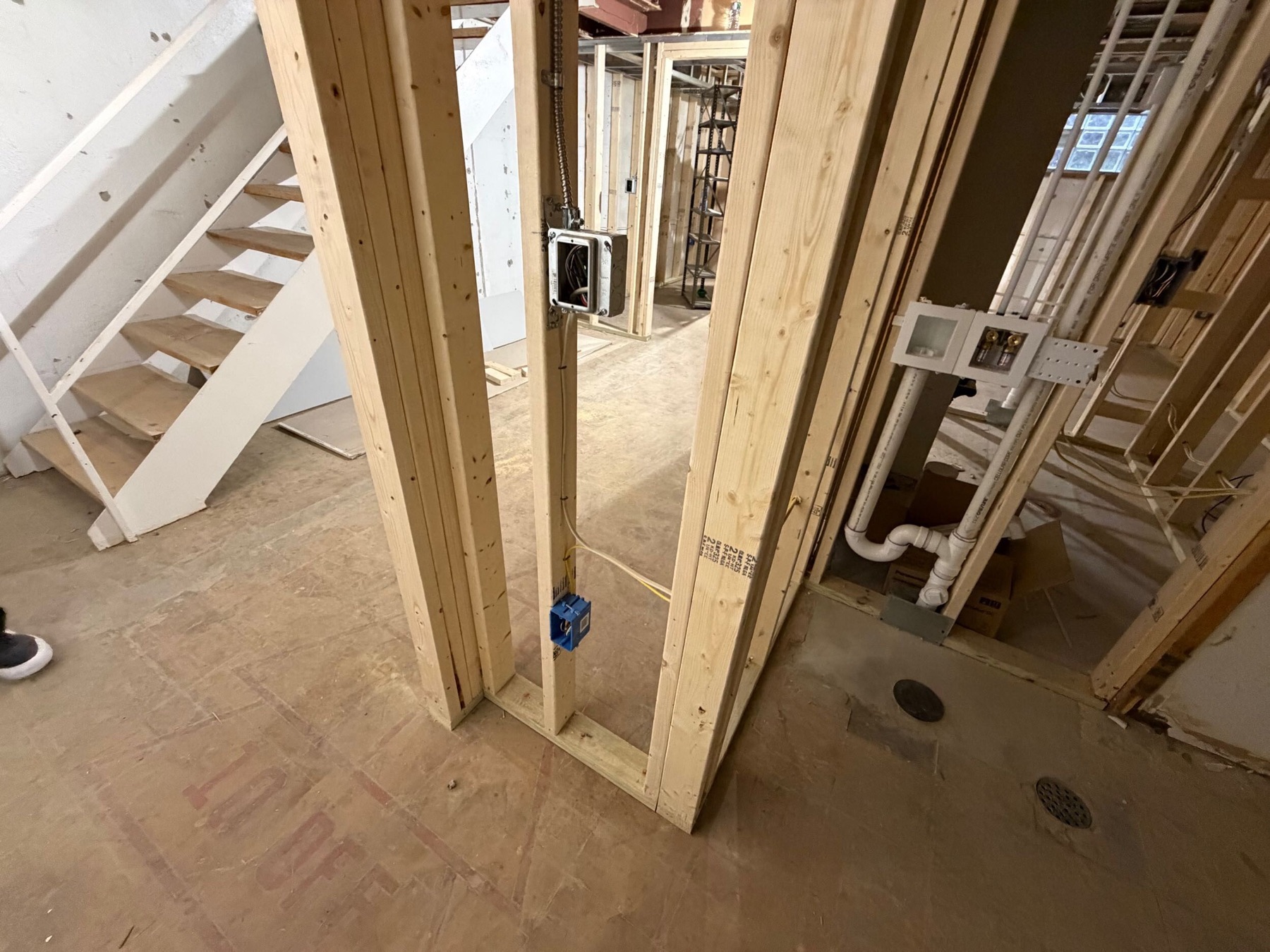 Lower-level framing defining basement rooms