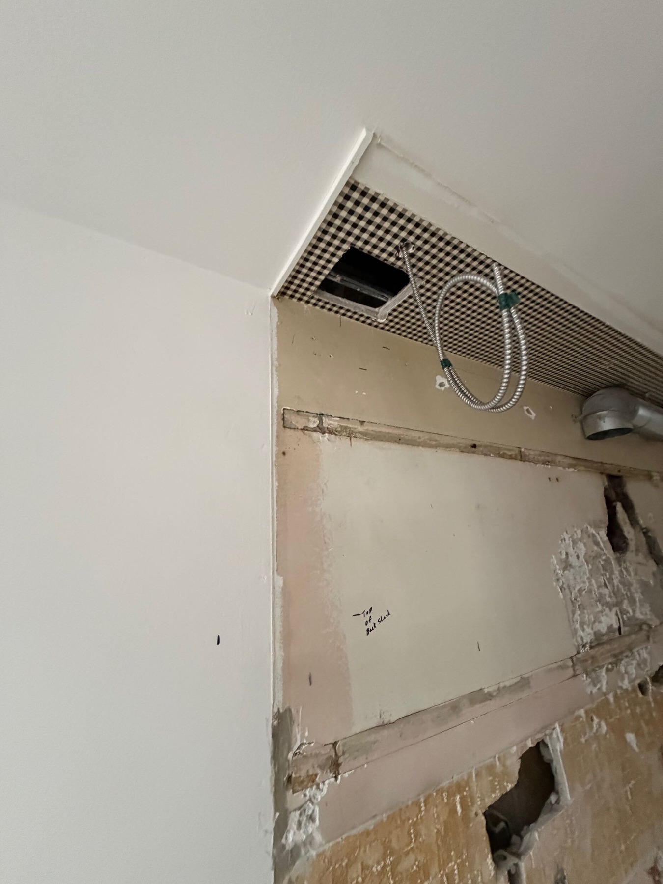 Wall surface with service opening
