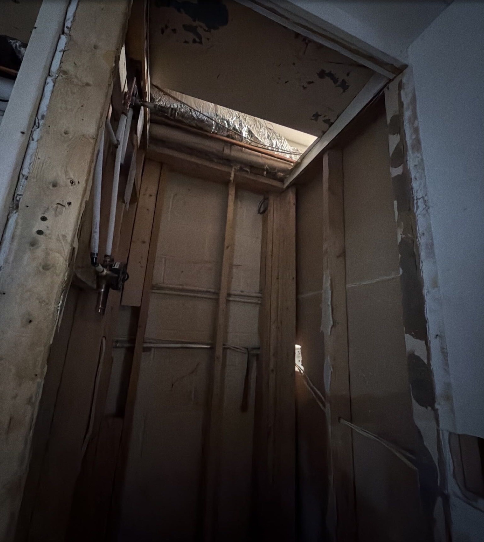 Open lower-level ceiling and framing